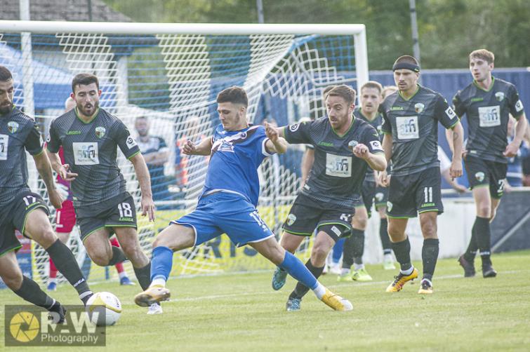 Mason Thomas-Jones surrounded by Saints defenders. Picture by Matthew Kelly of Rawphotography